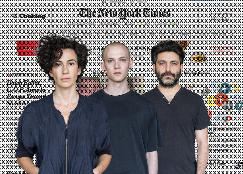 RoseAnne Spradlin's cast of X wear grey blue tops behind a background of X's